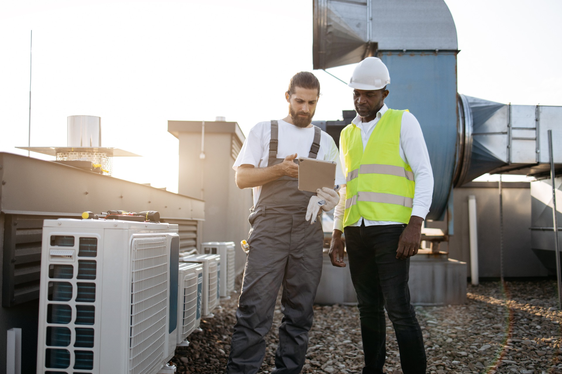 HVAC Professional talking to client about issues found.
